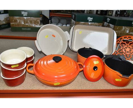 A GROUP OF LE CREUSET VOLCANIC ORANGE PANS AND OVENWARE, comprising two saucepans  size 16, a covered Buffet casserole size 2