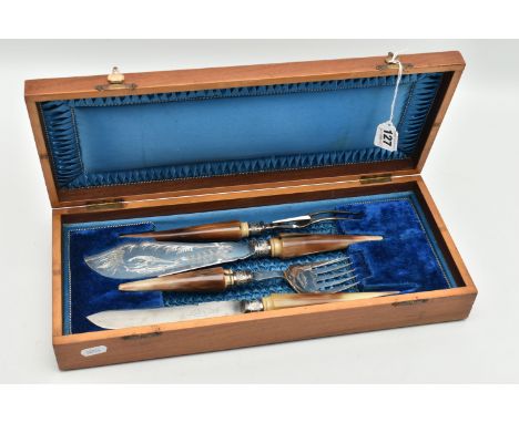 A CASED CARVING SET, to include fish servers, meat fork and carving knife, each fitted with stainless steel blades signed 'Sl