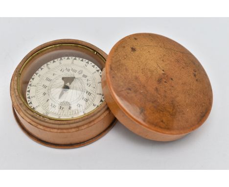A TREEN POCKET COMPASS, approximate width 54.8mm, instructions label to the base (condition report: general light wear, not t