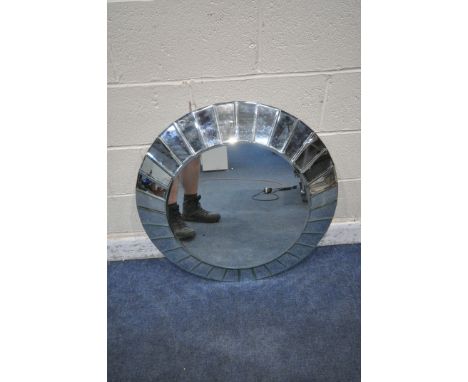 AN R V ASTLEY CIRCULAR WALL MIRROR, with bevelled mirror segment frame, diameter 78cm (condition report: has a couple of smal