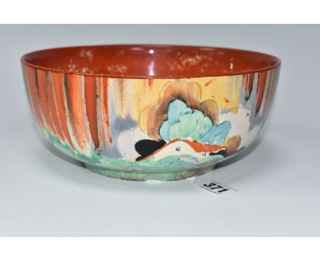 A CLARICE CLIFF 'FOREST GLEN' PATTERN BOWL, painted with a cottage landscape on an orange-red dripped ground, with orange-red