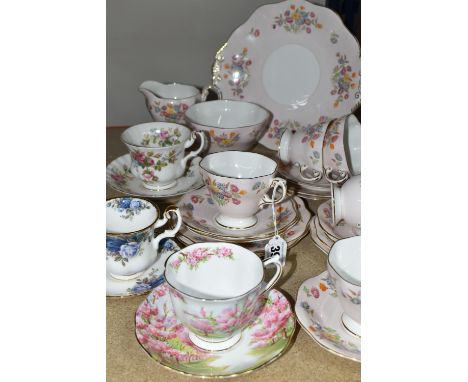 A FOLEY BONE CHINA TEA SET PATTERN 2869, multicoloured meadow flowers on a pink ground, comprising a cake plate, milk jug, su