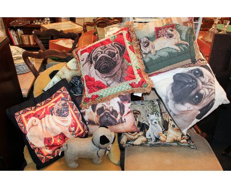 Five various pug dog design cushions, a pug doorstop, shopping bag, and another cushion with dog design cover