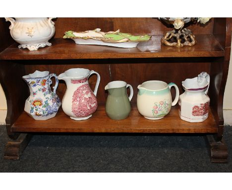 A collection of five various ceramic jugs including Susie Copper, Wedgwood, and a Masons Ironstone Swansea pattern
