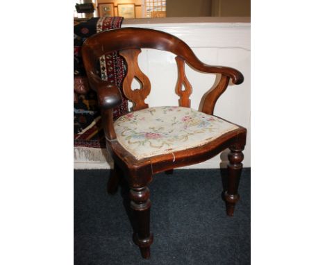 A Victorian mahogany carver dining chair, with pierced back splats and tapestry upholstered seat, on turned front legs