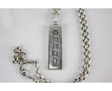 An Elizabeth II Britannia silver ingot, dated 1977 on chain stamped sterling