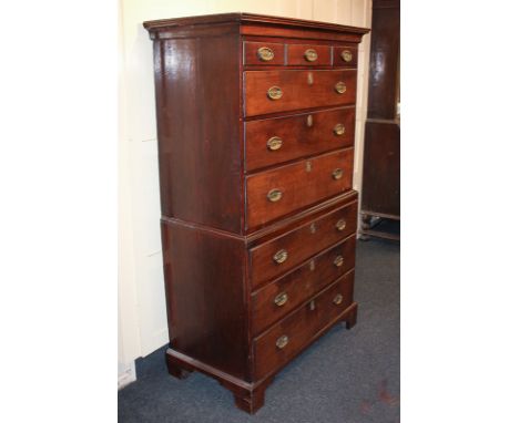 A 19th century mahogany chest on chest, of three short over three long drawers, above a base of three drawers, brass drop han