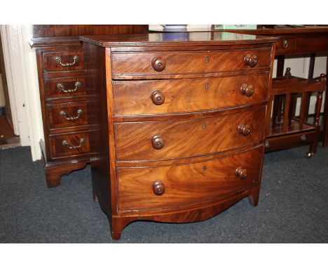 A 19th century mahogany small bowfront chest, of four graduated drawers, with knob handles, on bracket feet, 66cm
