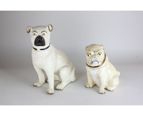 A Staffordshire china figure of a pug dog,  seated with black collar and muzzle, 28cm high, and a ceramic pug biscuit barrel,
