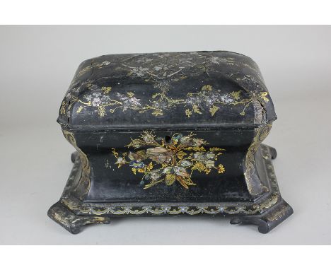 A Victorian black lacquered papier mâché tea caddy, with domed top (broken into three pieces) rectangular shape with circular