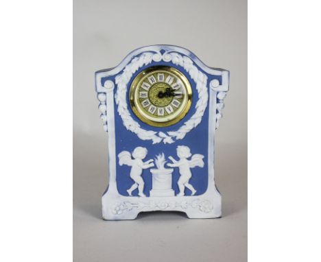 A West German blue Jasperware mantel clock depicting putti by a brazier, the gilt dial marked  Meccedes, 18cm high