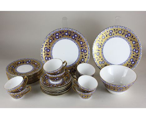 A Wedgwood porcelain part tea service with gilt and blue floral decoration (27) together with a set of twelve coffee cans and