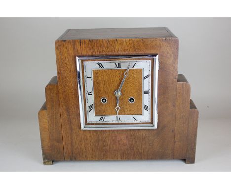 An Art Deco mahogany cased mantle clock, the Roman numerals on silverised dial (missing glass).  The movement stamped J Ungha