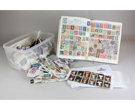 A Victory stamp album, containing British and world stamps, a large collection of loose stamps and a 1981 Royal Wedding First