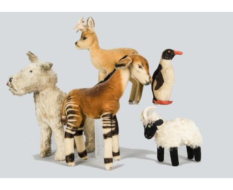 Post-war Steiff animals, a mohair Okapi —15in. (38cm.) high, a deer, a mountain goat and penguin (slight wear); and terrier d