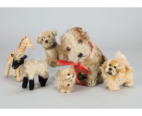 Steiff animals, a seated Molly dog with white and brown tipped mohair, brown and black glass eyes and swivel head —9in. (22.5
