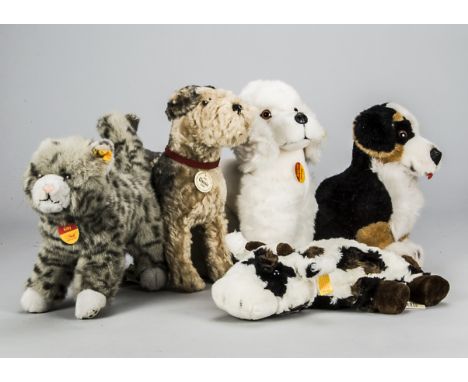 Five Steiff yellow tagged animals, a Mopsy poodle —11in. (28cm.) high, 1935 Classic Fellow; a Kitty, a Cosy Friend cow; and a