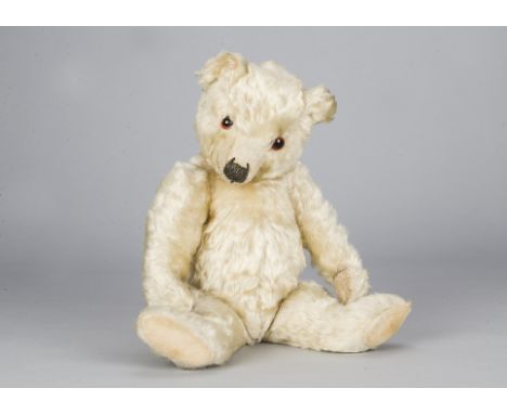 A rare white Chiltern Hugmee teddy bear 1930s,  with orange and black eyes, pronounced clipped muzzle, black stitched nose, m