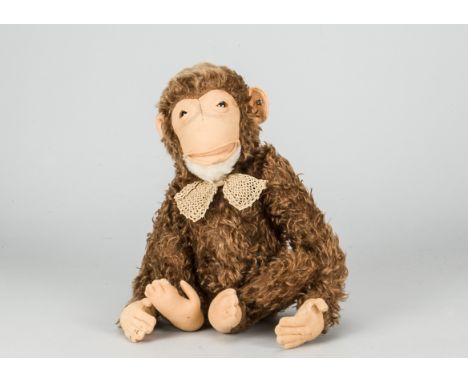 A Steiff post-war Jocko chimpanzee,  with brown mohair, brown and black glass eyes, felt face, ears, hands and feet, swivel h