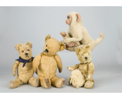 Three post-war teddy bears and a monkey, a Pedigree with golden mohair and velvet pads —17in. (43cm.) high, a small Farnell (