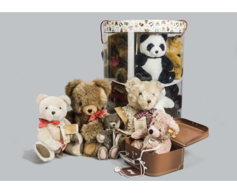 Manufactured teddy bears, four Hermann limited edition teddy bears, a Steiff yellow tagged Flynn, in suitcase and a Harrods S