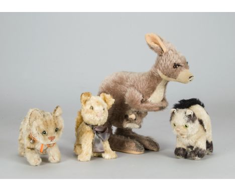 Cats and a Kanga soft toys, Steiff post-war - Gussy and Topsy cats —6½in. (16.5cm.) long; an artificial silk cat; and a Merry