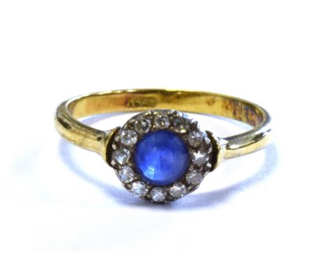 VINTAGE SAPPHIRE AND DIAMOND RING 8.3mm diameter head, with grain set round violet blue sapphire surrounded by a halo of sing