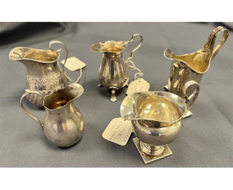 A COLLECTION OF ANTIQUE SILVER JUGS to include one 8.7cm tall of baluster form, hallmarked Sheffield 1903 by James Deakin &am