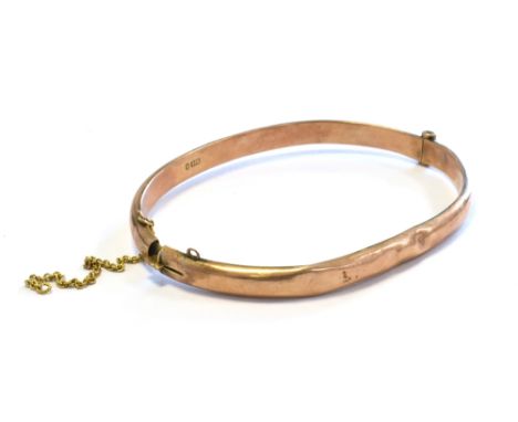 ANTIQUE 9CT ROSE GOLD BANGLE 5.3mm wide, oval profile, with safety chain.  Hallmarked 9.375 Chester 1915.  Weight 6.4 grams C