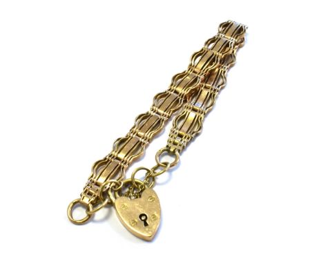 ANTIQUE 9CT GOLD GATE BRACELET 20cm long x 10.9mm wide, fancy arch and gate links, secured with a heart shaped padlock clasp,