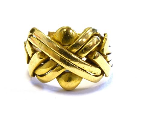 18CT GOLD TURKISH PUZZLE RING 14.0mm wide, ring size M, one part of shank broken.  Stamped 750.  Weight 9.1 grams