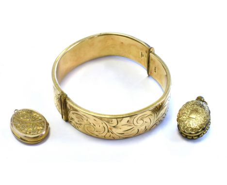 ROLLED GOLD BANGLE &amp; LOCKETS bangle 16.0mm wide with scroll and foliate engraved front, stamped 1/5th 9ct.  Total weight 