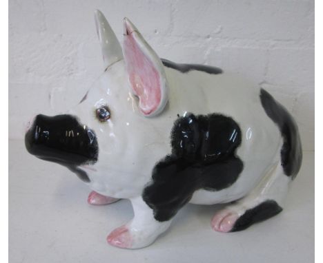 WEMYSS PIG, circa 1920, black and white spots with pink highlights, 45cm L x 25cm H. (tail and both ears broken and restored)