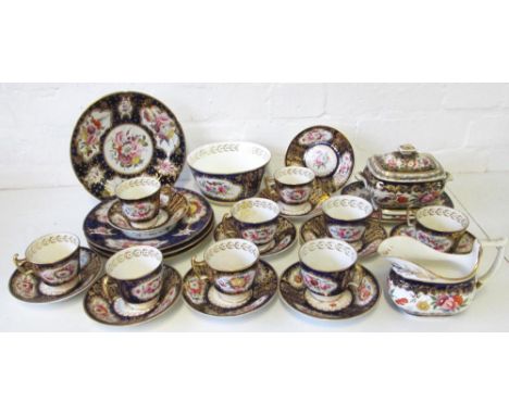 DERBY PART TEA SERVICE, early 19th century, finely painted with floral sprigs on a blue and gilt ground to include tea cups a