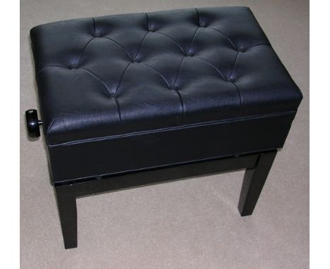 Piano Stool
A piano stool in a bright ebonised finish with storage under a button leather top.