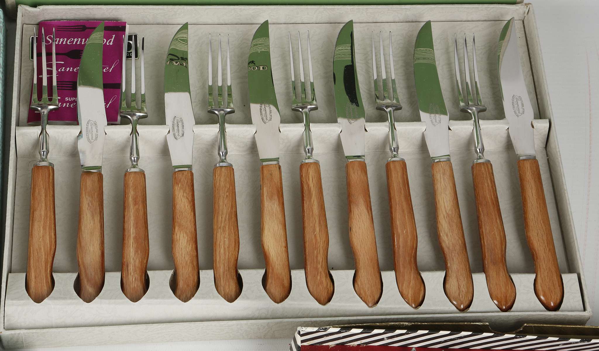 A collection of 1950/60's wooden handle designer cutlery in original ...