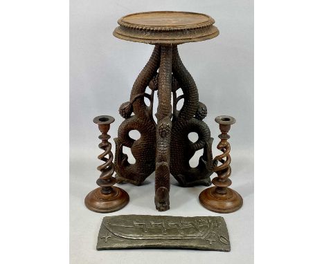 EASTERN HARDWOOD CARVED FISH TRIPOD TABLE, 52cms tall, a pair of open twist treen candlesticks, 26cms tall and a composition 