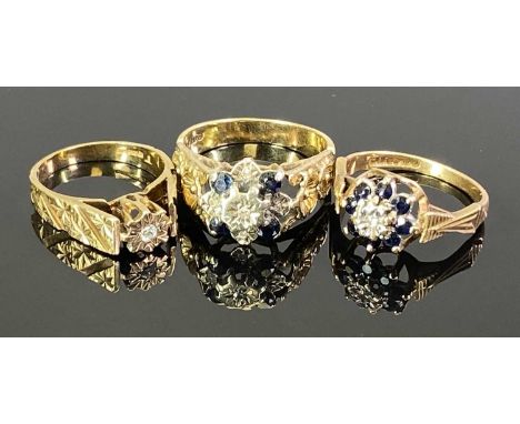 9CT GOLD RAISED SHOULDER DRESS RINGS (3) - one having a solitaire diamond in a floral illusion coronet mount, the raised shou