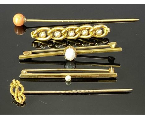 15CT GOLD STAMPED BAR BROOCHES &amp; A STICK PIN - one brooch set with a single oval opal, claw mounted 6 x 5mm stone, 5.5cms