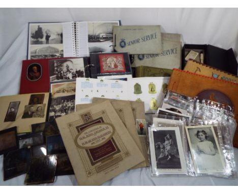Deltiology - a quantity of all period postcards, photographs, cigarette and trade cards in albums, sleeves and box, also a sm