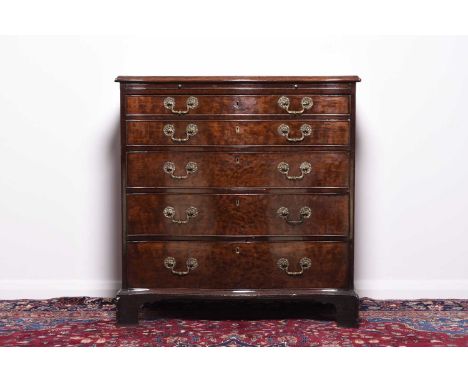 A George III mahogany serpentine fronted secretaire chestThe moulded top above a brushing slide and a double fronted secretai