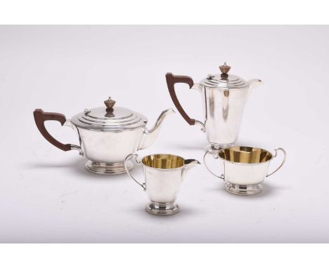 An Art Deco four piece silver tea service, Roberts &amp; Dore Ltd, Birmingham 1947, each piece of tapering form, comprising; 
