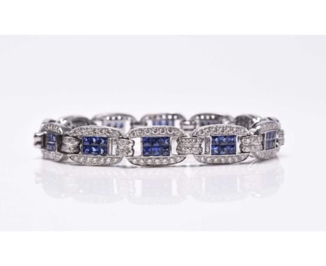 An Art Deco style sapphire and diamond bracelet, each link designed as a central panel of six square faceted sapphires set wi