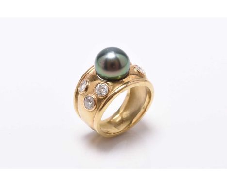 An 18ct gold Tahitian cultured pearl and diamond ring, designed as a central green-grey Tahitian cultured pearl mounted to br