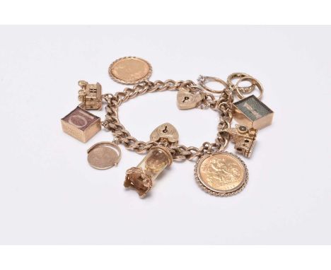 A 9ct gold flat curb link bracelet with attached charms, the bracelet with two heart shaped padlock clasps, attached charms c