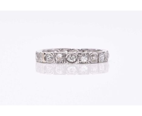 A diamond eternity ring, the old cut diamonds claw and box set in white metal, not stamped, ring size M, weight approx 3.6gCo