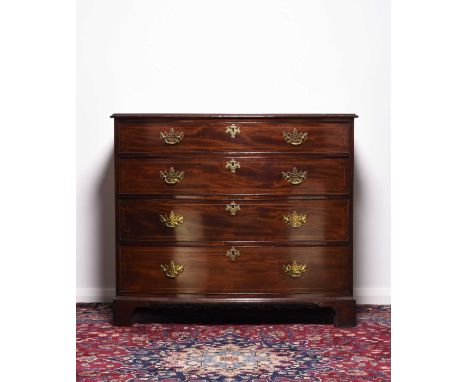 A George III mahogany bow-front chest of drawersThe moulded top above four long graduated cock-beaded and line-inlaid drawers