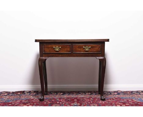A 19th century mahogany fold-over tea tableThe plain top above two cock-beaded frieze drawers, raised on cabriole supports te
