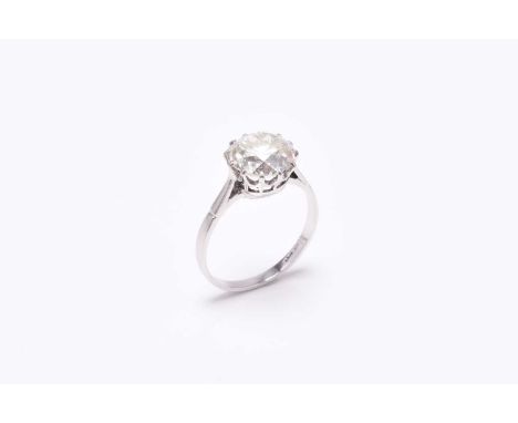 A single stone diamond ring, the old cut diamond claw set in white metal to white metal shank, indistinctly stamped 'plat', d