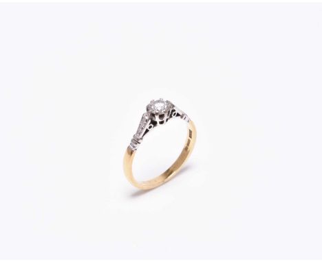 An 18ct gold single stone diamond ring, the brilliant cut diamond claw set in white gold to yellow gold shank, size M 1/2, we